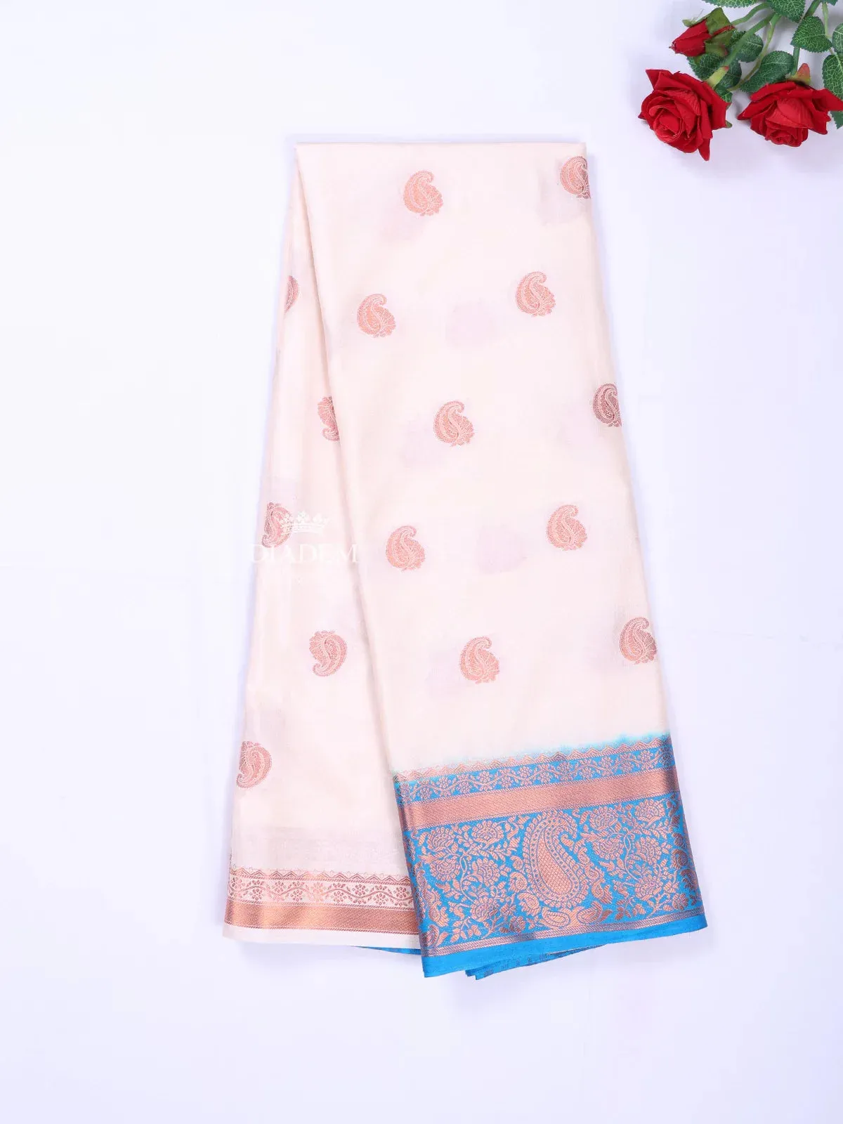 Cream Art Silk Saree with Paisley Motif on the body and Contrast Zari Border