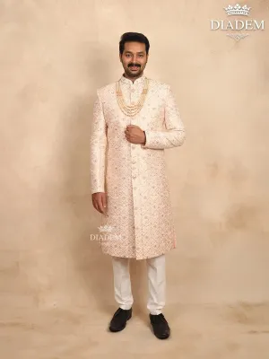 Cream Raw Silk Sherwani Suit with Floral Threadwork Embroidery, Paired with Bead Mala